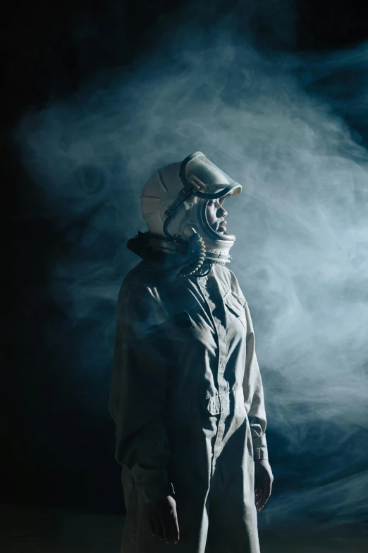 a man in a gas mask standing next to a fire hydrant, inspired by ridley scott, unsplash contest winner, afrofuturism, beautiful woman in spacesuit, smoke filled room, astronaut on the moon, model wears a puffer jacket