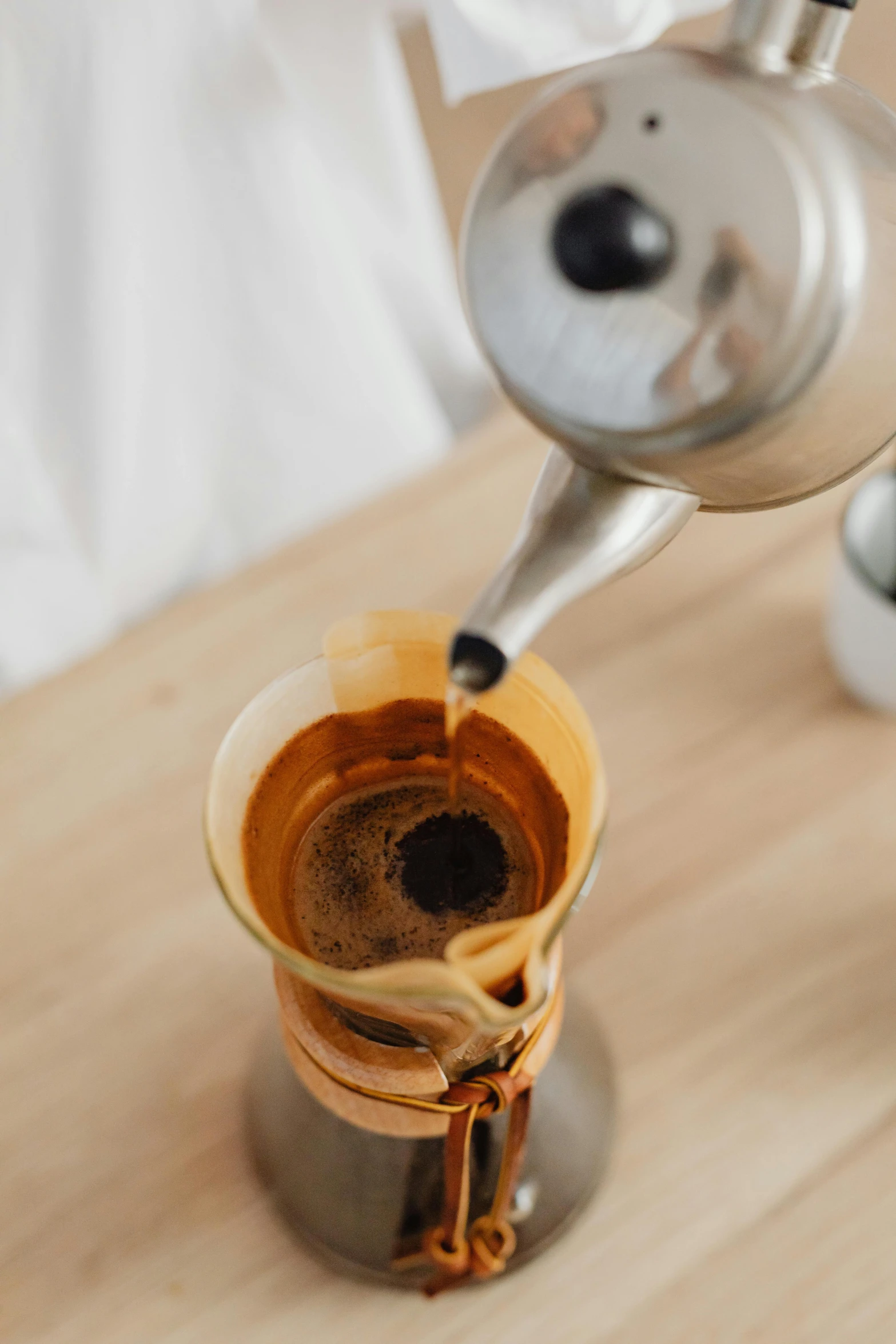 a person pours a cup of coffee, process art, neck zoomed in, cone shaped, mana flowing around it, ochre