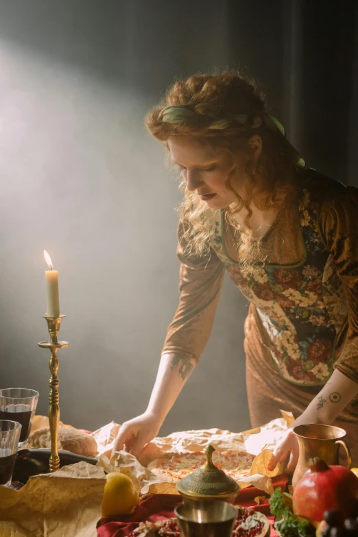 a woman standing over a table covered in food, inspired by Pierre Auguste Cot, pexels, renaissance, dramatic candlelight, sullen old maid ( redhead, still from the movie, scene from church