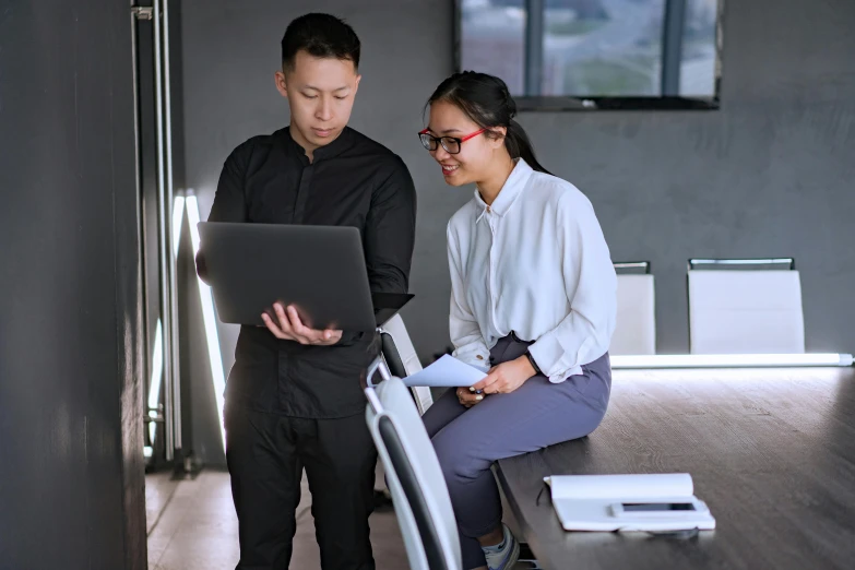 a man and a woman looking at a laptop, a computer rendering, by Reuben Tam, pexels contest winner, standing on a desk, asian descend, wearing business casual dress, te pae