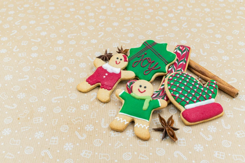 a couple of cookies sitting on top of a table, a picture, red and green, listing image, background image, ornamentation