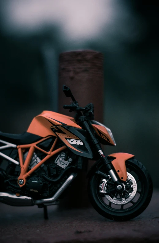 a close up of a motorcycle parked on a street, pexels contest winner, photorealism, orange and black, 3 d render n - 9, night shot, octane render - n 6