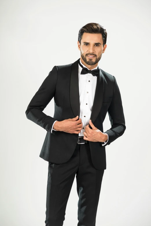 a man in a tuxedo standing with his hands in his pockets, inspired by Ramon Pichot, black jacket | shiny, main colour - black, thumbnail, caparisons