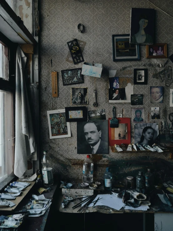 a room that has a bunch of pictures on the wall, a surrealist painting, pexels contest winner, ilya repin and andrei tarkovsky, workbench, promo image, detailed portrait