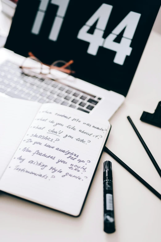 a laptop computer sitting on top of a white desk, by Carey Morris, unsplash contest winner, with notes, black marker, handcrafted, thumbnail