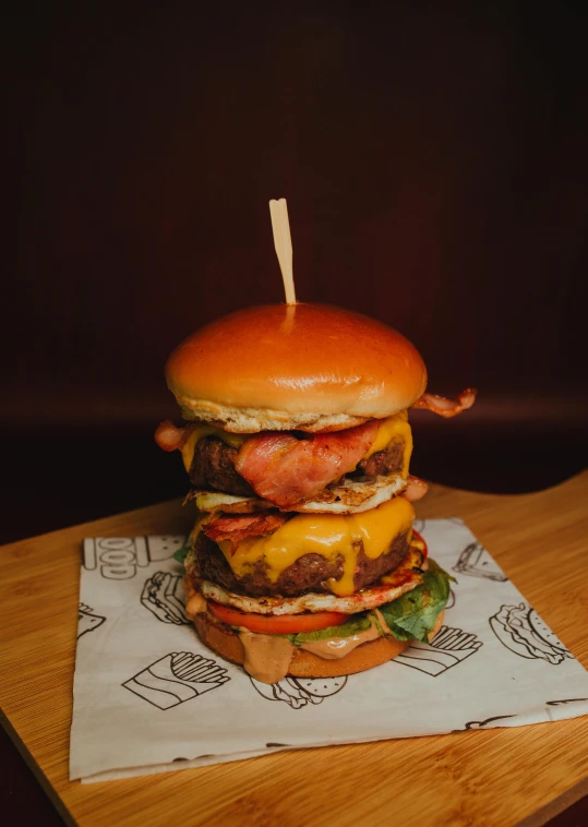 a large hamburger sitting on top of a wooden table, profile image, bacon, cronobreaker, full product shot