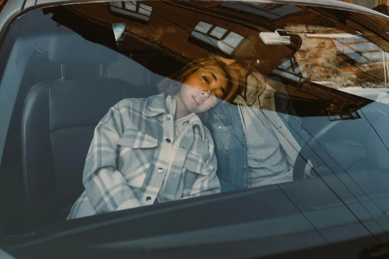 a woman sitting in the passenger seat of a car, an album cover, inspired by Elsa Bleda, trending on pexels, photorealism, double denim, :: madison beer, frank moth, more reflection