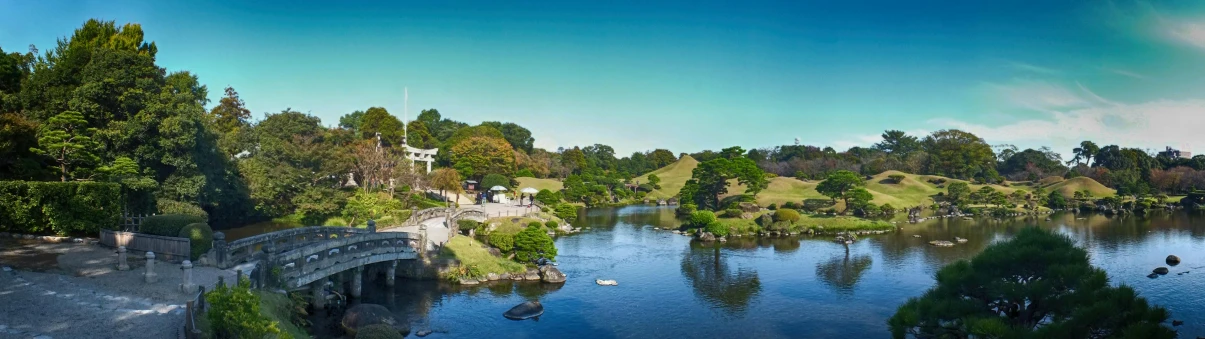 a bridge over a body of water surrounded by trees, inspired by Tōshi Yoshida, pexels contest winner, sōsaku hanga, park on a bright sunny day, panoramic view, himeji rivendell garden of eden, hyper real photo