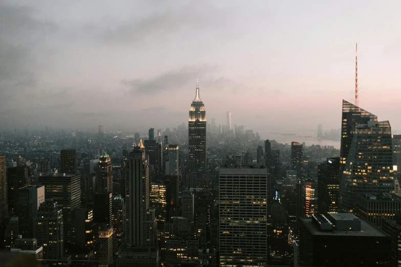 a view of a city from the top of a building, by Adam Rex, pexels contest winner, overcast dusk, new york backdrop, very hazy, instagram post