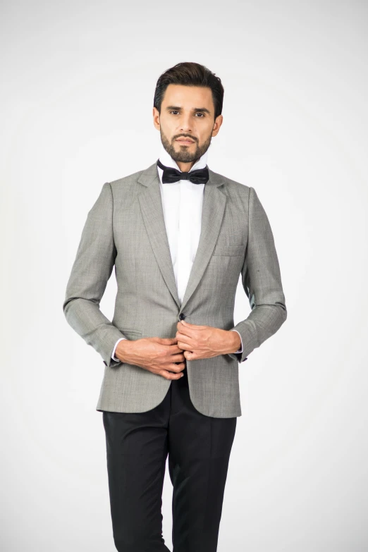 a man wearing a suit and bow tie, silver garment, thumbnail, front, bangalore