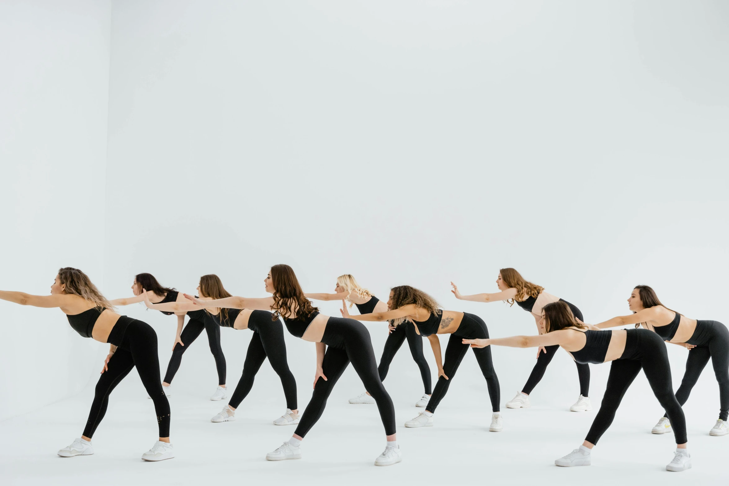 a group of women in black leo leo leo leo leo leo leo leo leo leo leo leo, pexels contest winner, arabesque, with a white background, bent - over posture, leggings, 8 k -