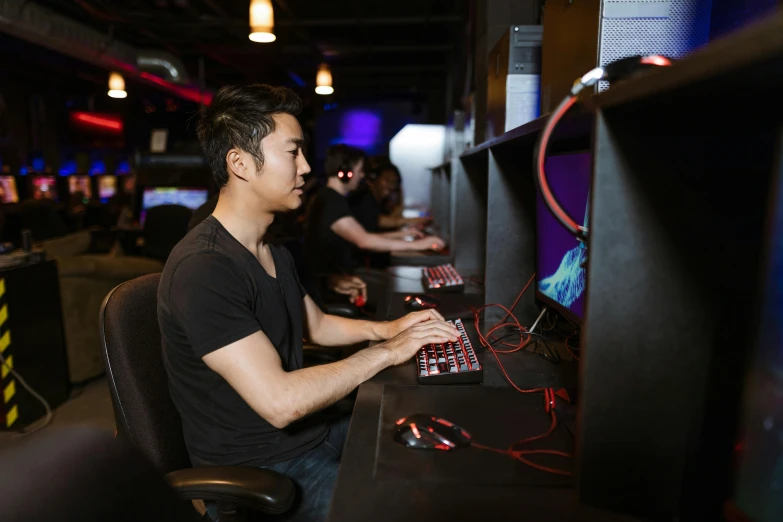 a man sitting at a desk in front of a computer, sierra entertainment games, darren quach, server in the middle, 15081959 21121991 01012000 4k