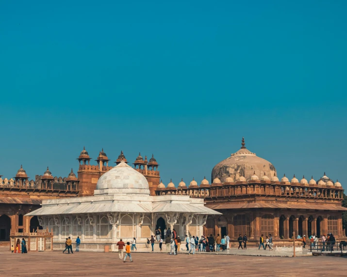 a group of people standing in front of a building, by Julia Pishtar, pexels contest winner, renaissance, india, geodesic building, a wide open courtyard in an epic, audrey plaza
