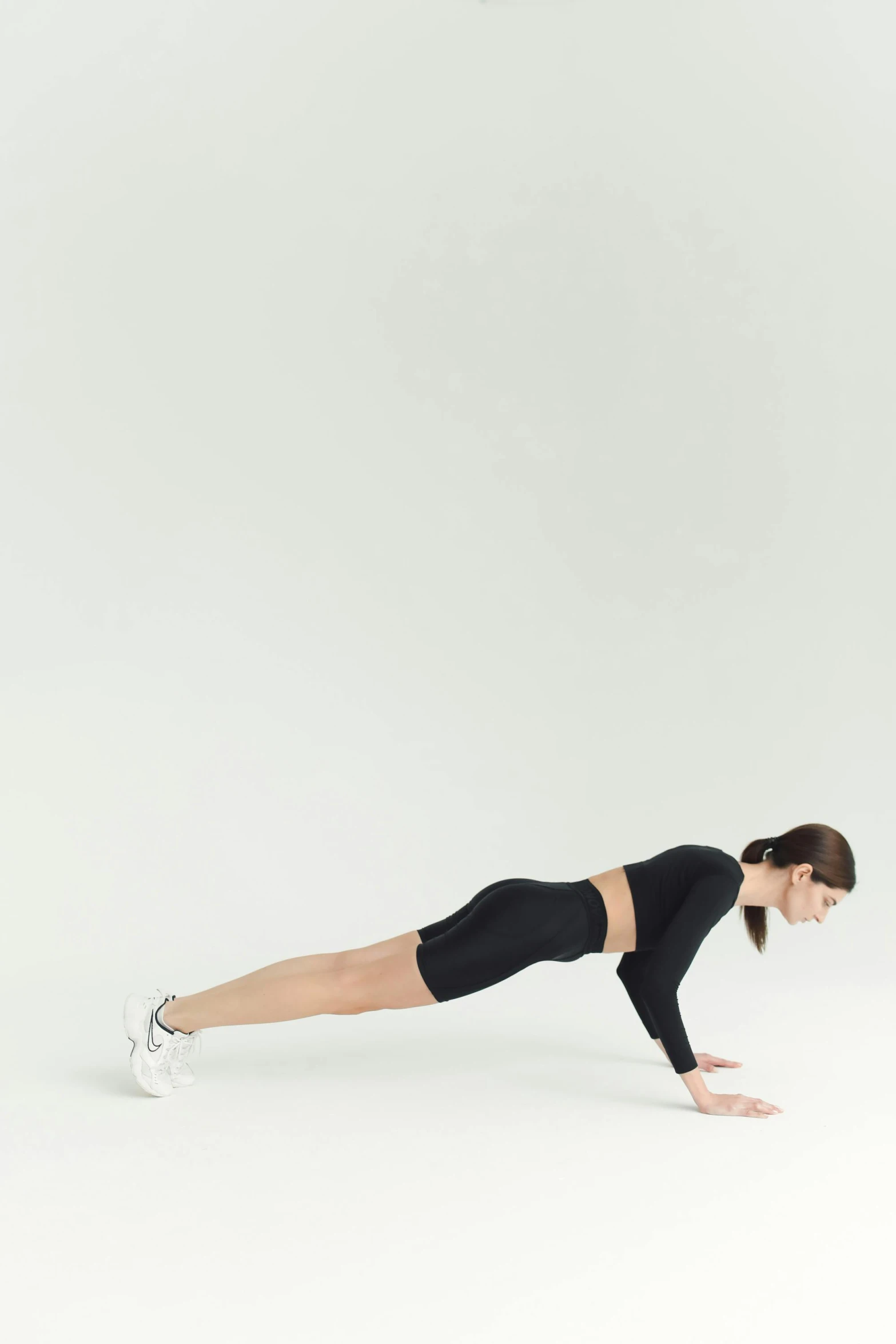 a woman doing a plank plank plank plank plank plank plank plank plank plank plank plank plank plank plank plank plank plank plank plank plank plank plank plank, by Nina Hamnett, arabesque, mid view from below her feet, plain background, jen atkin, medium poly