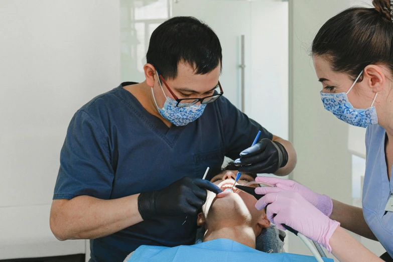 a man getting his teeth examined by a dentist, pexels contest winner, hyperrealism, jin shan and ross tran, thumbnail, wearing facemask, amanda lilleston