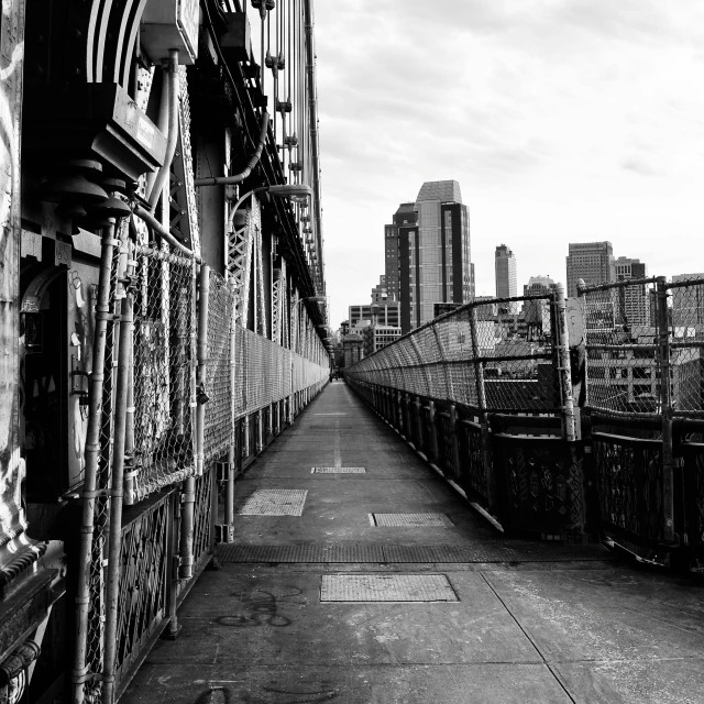 a black and white photo of a bridge, inspired by Thomas Struth, unsplash contest winner, graffiti, new york streets, detailed medium format photo, city view, fullbody view