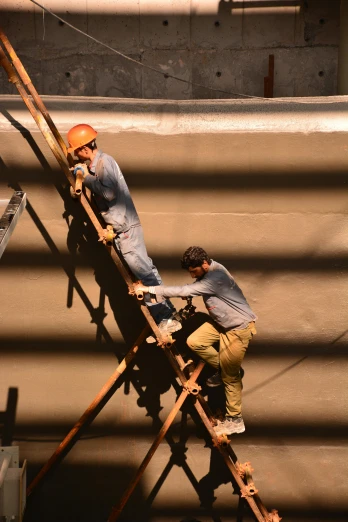 a couple of men that are standing on a ladder, by William Berra, pexels contest winner, renaissance, coating a stubborn core.', high angle, back lit, heavy line work