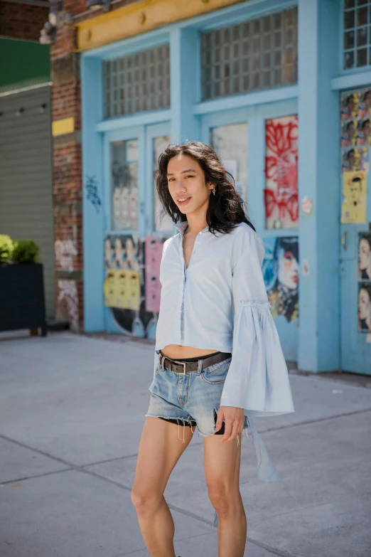 a woman riding a skateboard down a sidewalk, inspired by Alexis Simon Belle, pexels contest winner, wearing a light blue shirt, li bingbing, exposed midriff, in new york