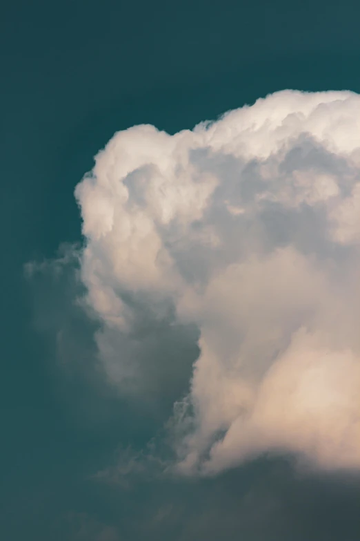 a plane flying through a cloudy blue sky, an album cover, inspired by Elsa Bleda, unsplash, romanticism, giant cumulonimbus cloud, ignant, closeup portrait, cotton candy