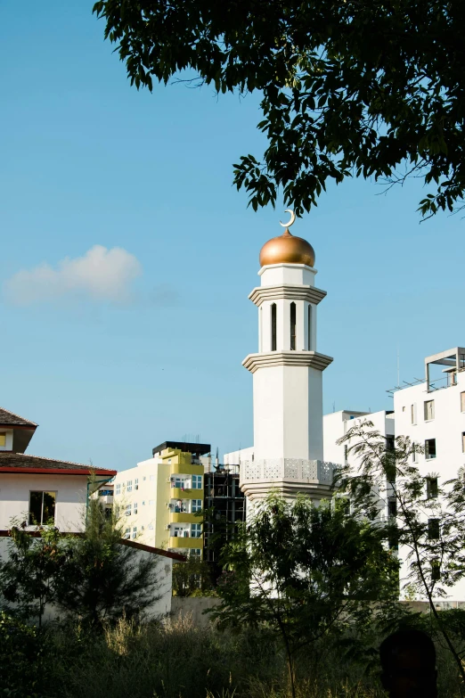 a tall white building with a gold dome, inspired by Francisco Zúñiga, hurufiyya, mosque, shenzhen, from afar, residential area