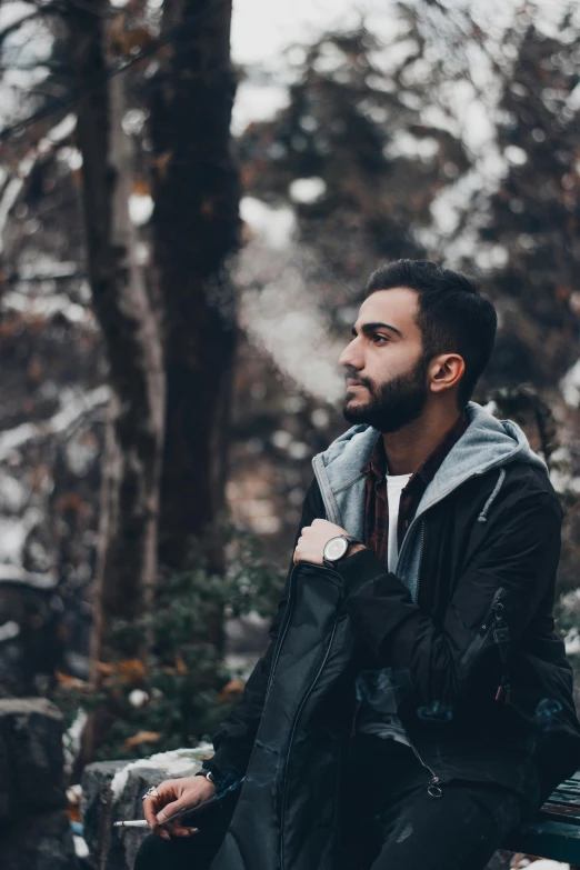 a man sitting on a bench in the woods, by Ismail Acar, pexels contest winner, wearing a turtleneck and jacket, profile pic, confident stance, profile picture 1024px