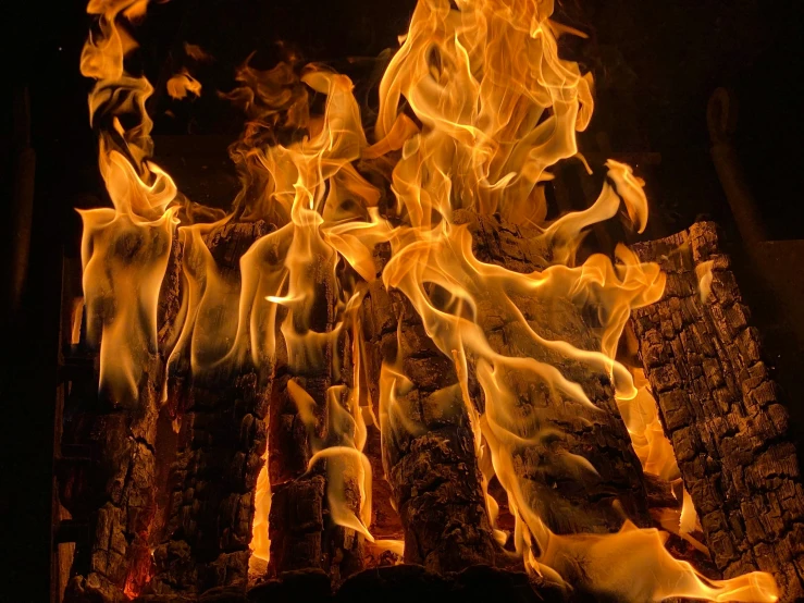 a close up of a fire burning in a fireplace, by Daniel Lieske, pexels contest winner, renaissance, bushfire, promo image, multiple stories, hyperdetailed photo