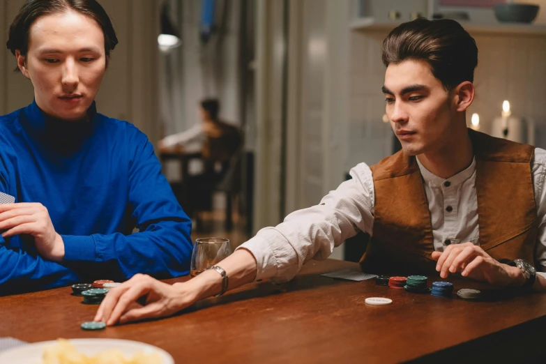 two men sitting at a table playing cards, by Emma Andijewska, pexels contest winner, cai xukun, looking from shoulder, 15081959 21121991 01012000 4k, thumbnail