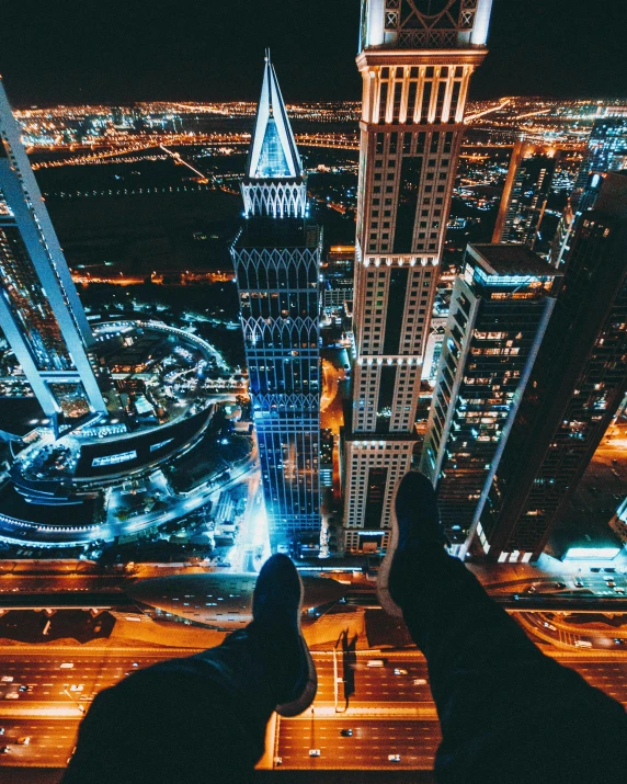 a person standing on top of a tall building, by Adam Rex, pexels contest winner, arabian night, detailed legs towering over you, tech city in the background, instagram post