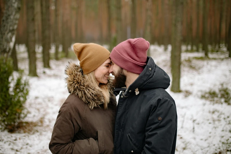 a man and woman standing next to each other in the snow, pexels contest winner, natural beard, in forest, lesbian, thumbnail