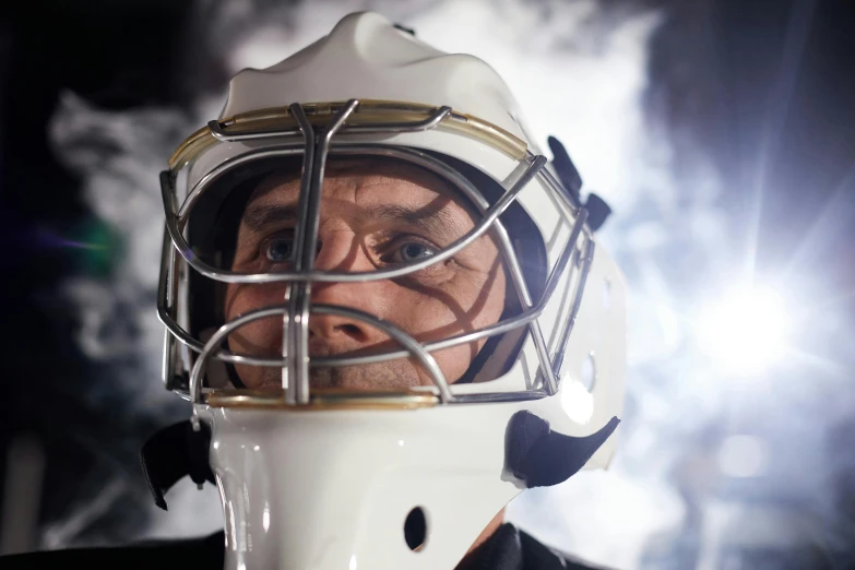 a close up of a person wearing a hockey helmet, inspired by John Gibson, commercial shot, rectangle, commercial, seasonal