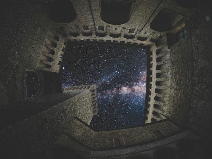 a view of the milky from inside of a building, by Adam Marczyński, inside a castle, space photography, looking to stars, wide high angle view