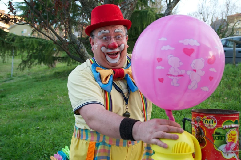 a man dressed as a clown holding a balloon, pink iconic character, tamborine, family friendly, extremely high budget