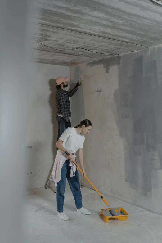 a couple of people that are standing in a room, unsplash, arbeitsrat für kunst, wet concrete, repairing the other one, demur, 15081959 21121991 01012000 4k