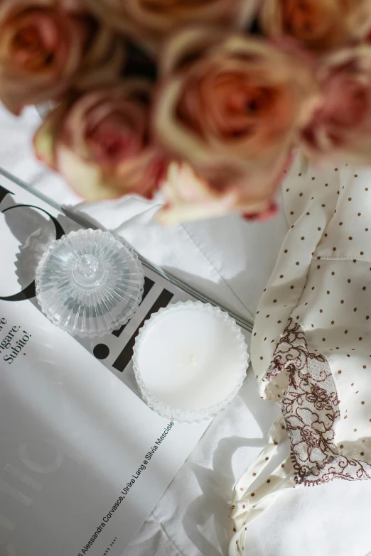 a bunch of flowers sitting on top of a table, holding a candle, lacey accessories, detailed product shot, paper