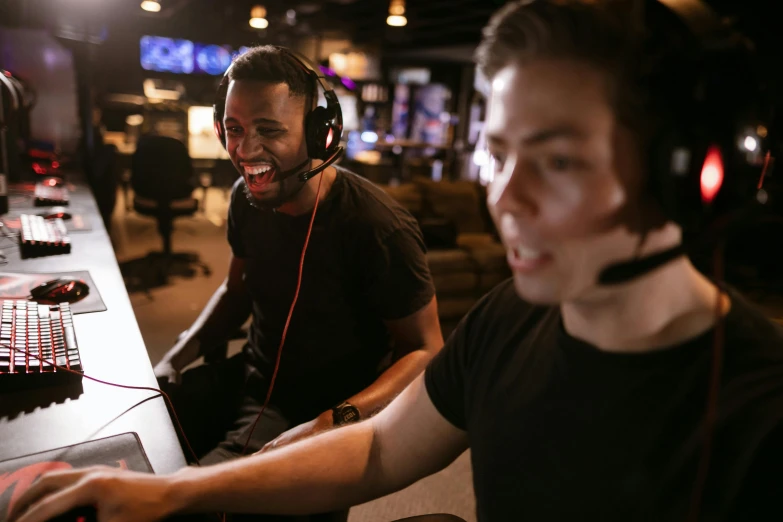 a couple of men sitting next to each other in front of a computer, sierra entertainment games, excited facial expression, wearing a headset, performance