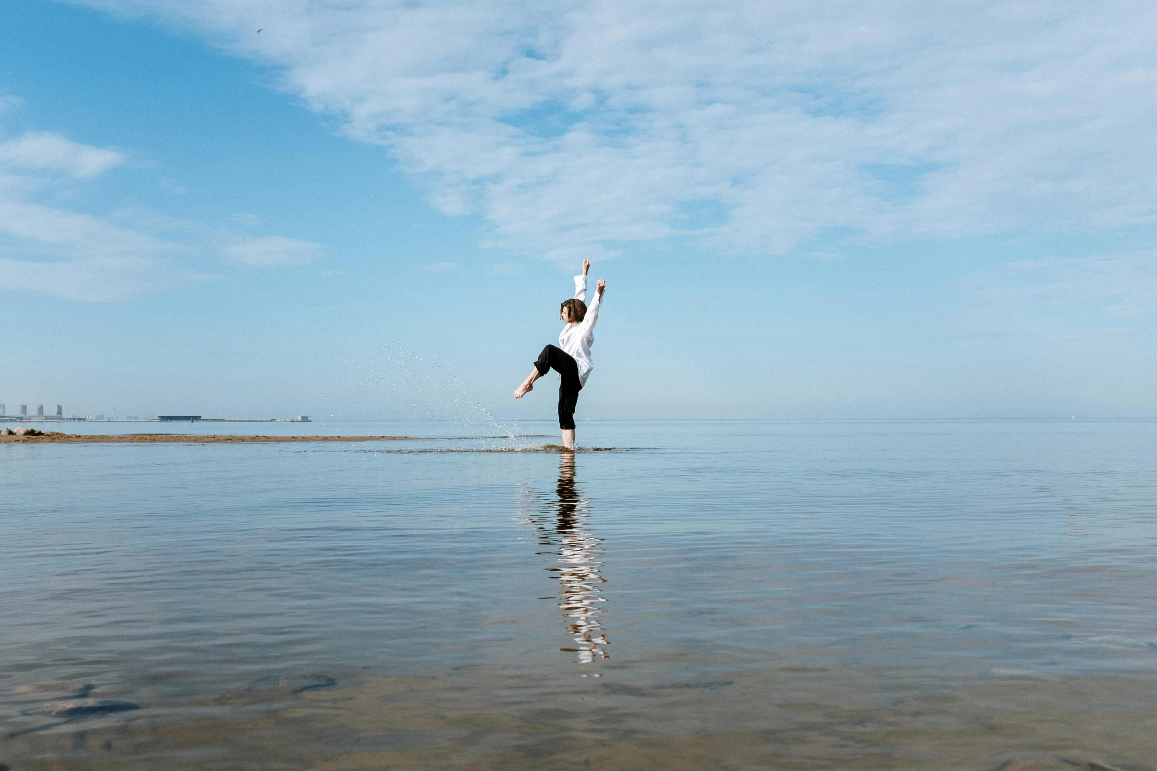 a person standing in the middle of a body of water, arabesque, at the seaside, highly upvoted, performing, thumbnail