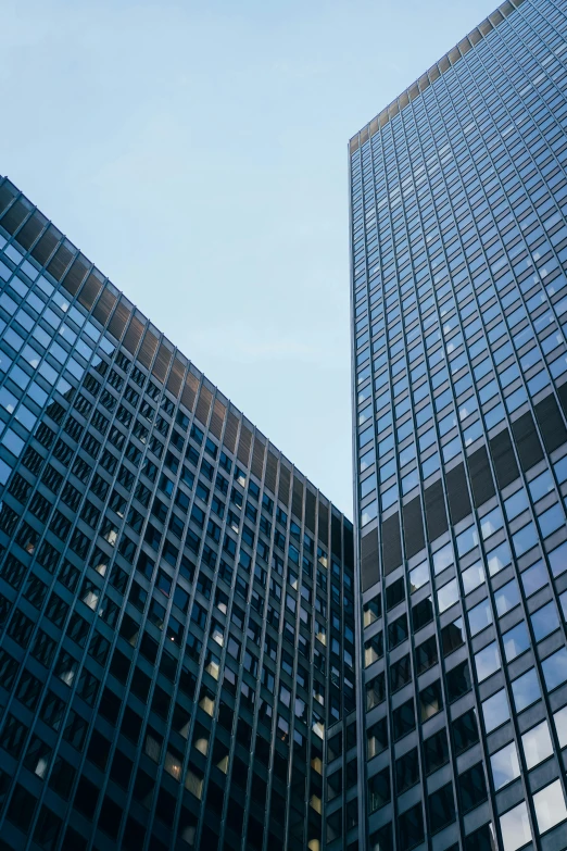 a couple of tall buildings next to each other, pexels contest winner, mies van der rohe, square lines, konica minolta, high resolution image