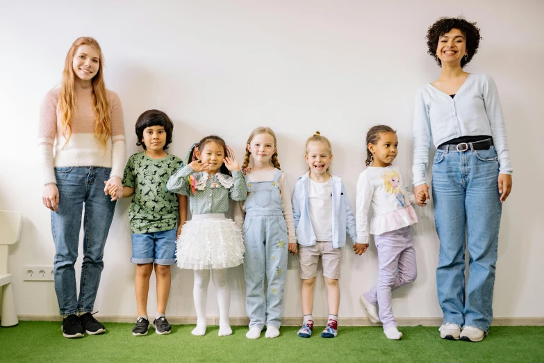 a group of children standing next to each other, by Ellen Gallagher, pexels contest winner, antipodeans, full body cute young lady, varying ethnicities, 15081959 21121991 01012000 4k, in a classroom