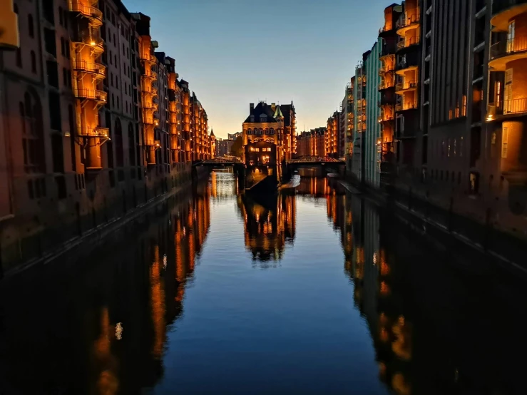 a canal filled with lots of water next to tall buildings, by Tobias Stimmer, pexels contest winner, calm evening, german renaissance architecture, slide show, profile picture 1024px