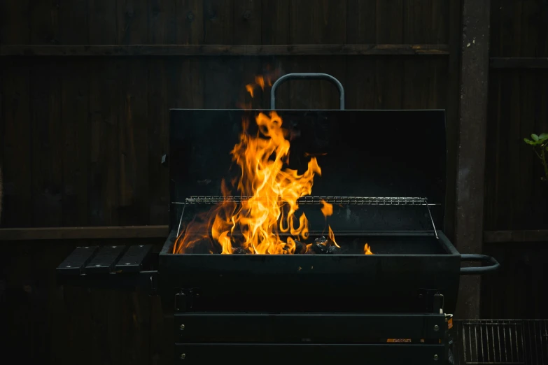 a close up of a grill with flames on it, by Daniel Lieske, pexels contest winner, smoke trailing out the back, rectangle, gif, smouldering charred timber