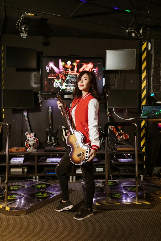 a woman sitting on a chair holding a guitar, an album cover, inspired by Jason Teraoka, pexels contest winner, standing in a starbase bar, holding electric guitars, gaming, shot with sony alpha 1 camera