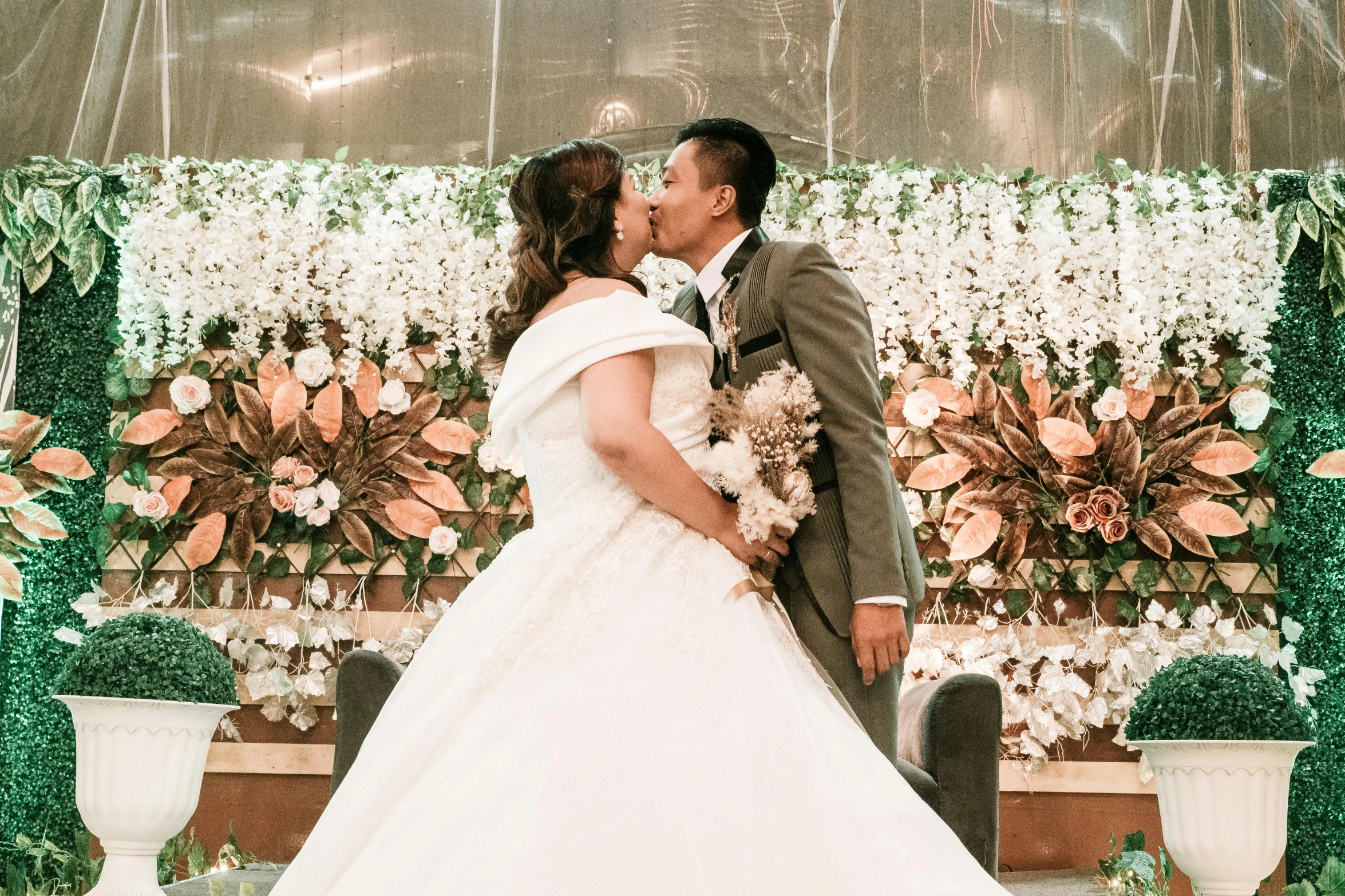 a bride and groom kissing under an umbrella, unsplash, happening, manila, standing in front of the altar, realistic », bbwchan