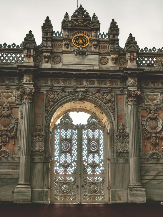 a close up of a building with a clock on it, there are archways, iron gate, baroque color scheme, turkish and russian
