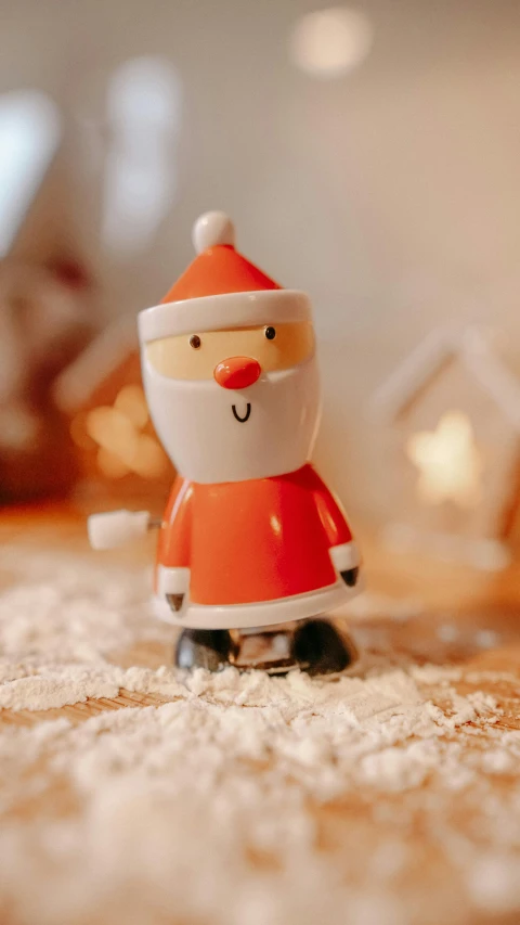 a close up of a santa figurine on a table, a cartoon, inspired by Ernest William Christmas, pexels, happening, walking towards camera, orange, cosy, salt shaker