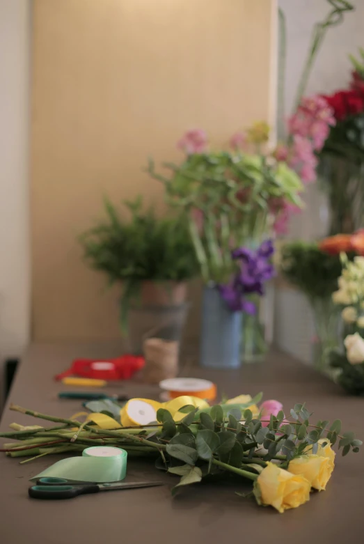 a bunch of flowers sitting on top of a table, various items, view from the side, commercially ready, during the day