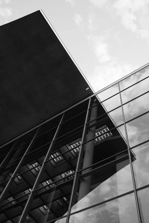 a black and white photo of a tall building, a black and white photo, by Bauhaus, unsplash, full of glass. cgsociety, square lines, black and white artistic photo, glass and lights