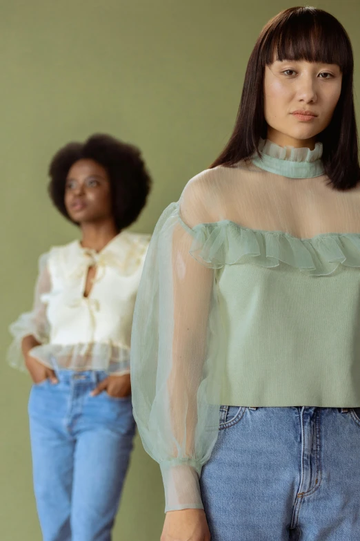 a couple of women standing next to each other, inspired by Elsa Bleda, renaissance, light green mist, off - white collection, wearing a cute top, detail shot