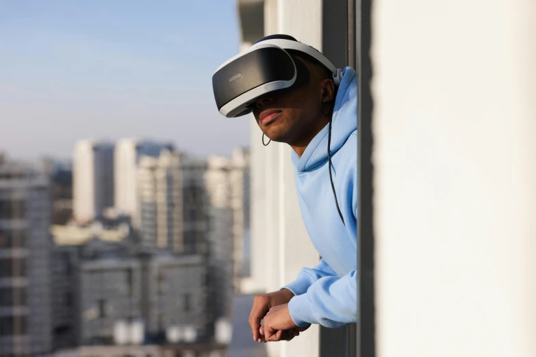 a man wearing a virtual reality headset looking out a window, inspired by Victor Enrich, unsplash, happening, captured with sony a3 camera, samsung smartthings, exterior shot, wearing a gaming headset