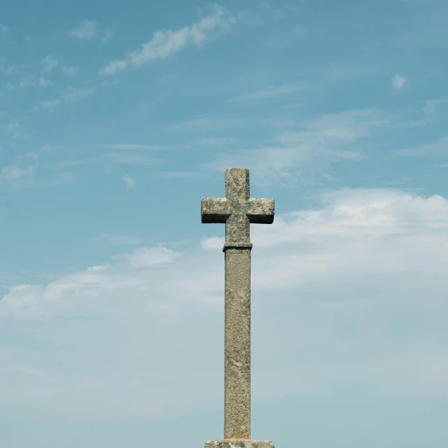 a stone cross sitting in the middle of a field, cloudless-crear-sky, daniel mirante, zurbaran, grey