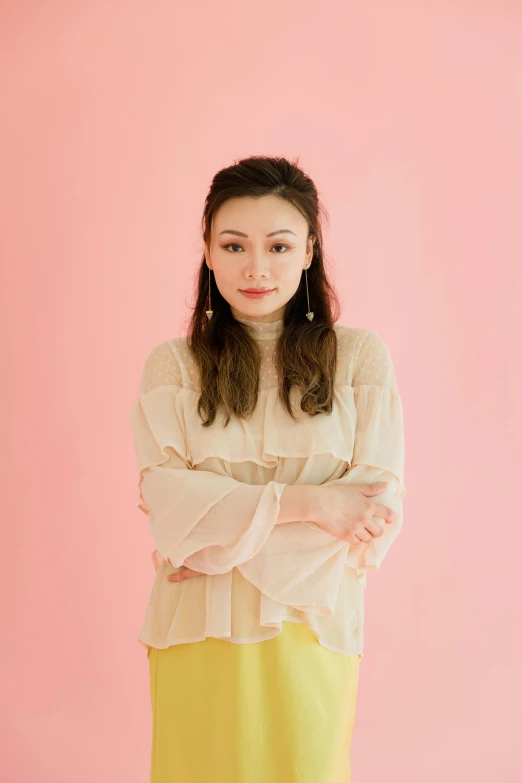 a woman standing in front of a pink wall, an album cover, shin hanga, portrait image, 2 people, yellow backdrop, in front of white back drop